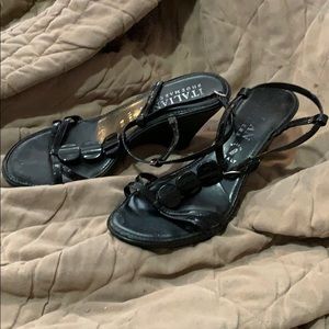 Woman’s black wedge strap heels